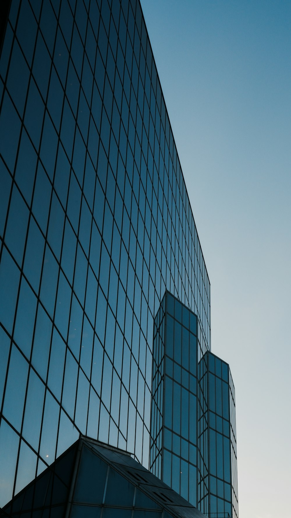 a tall building with a lot of windows next to it