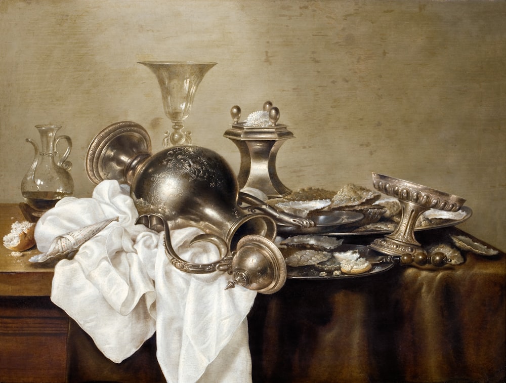 a painting of a table with silverware on it