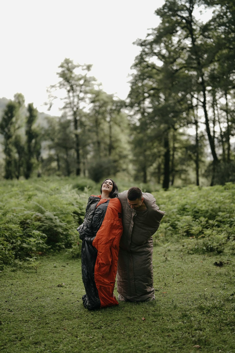 a couple of people that are standing in the grass