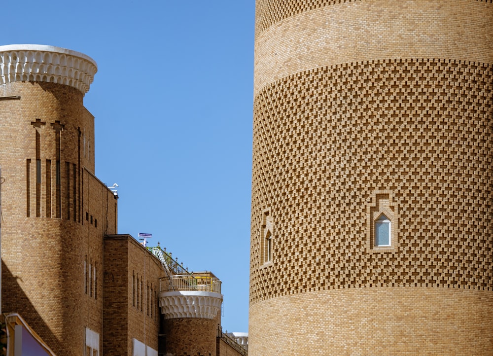 a tall brick building next to a tall brick building