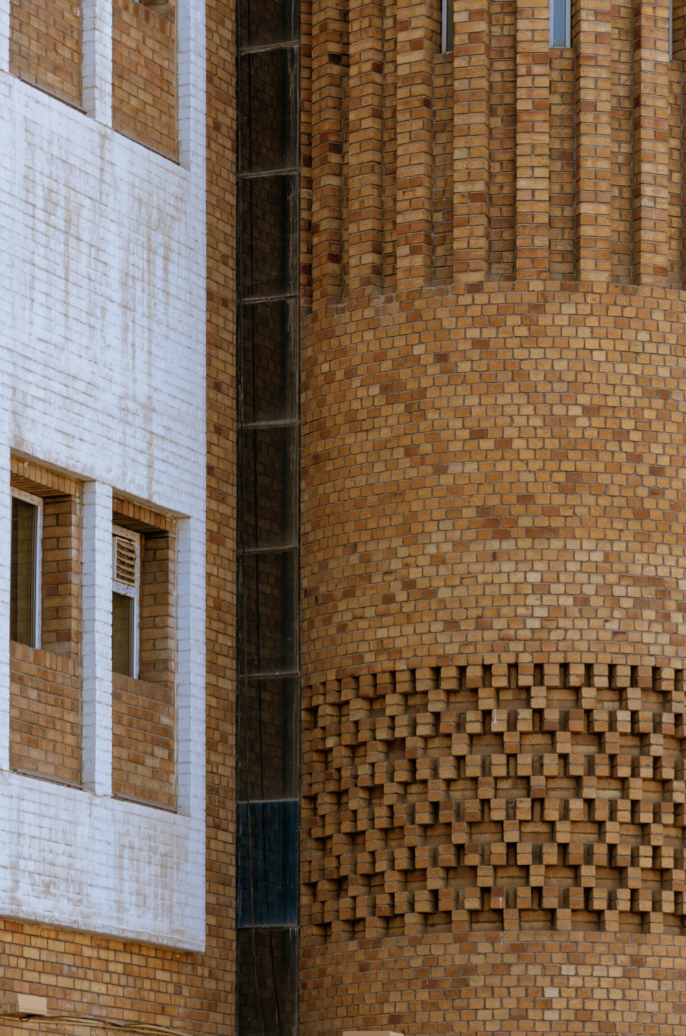 a brick building with a clock on the side of it