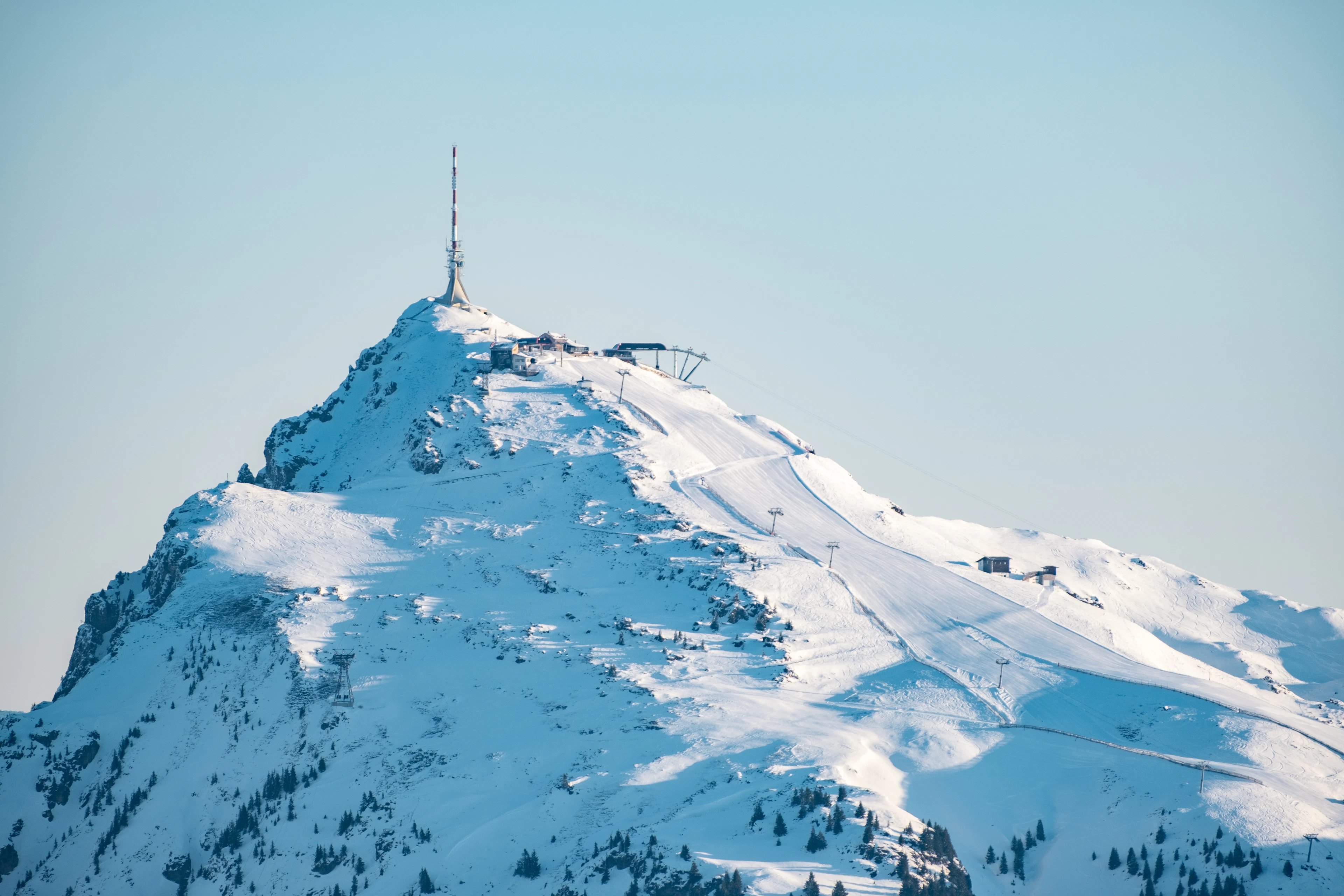 The Kitzbüheler Horn and its radio tower in the snow