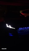 Elegant XPeng G9 illuminated at night, showcasing its design.