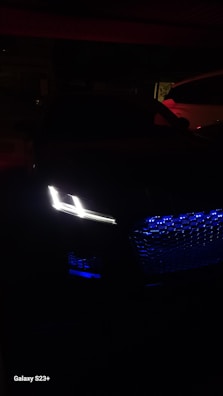 Elegant XPeng G9 illuminated at night, showcasing its design.