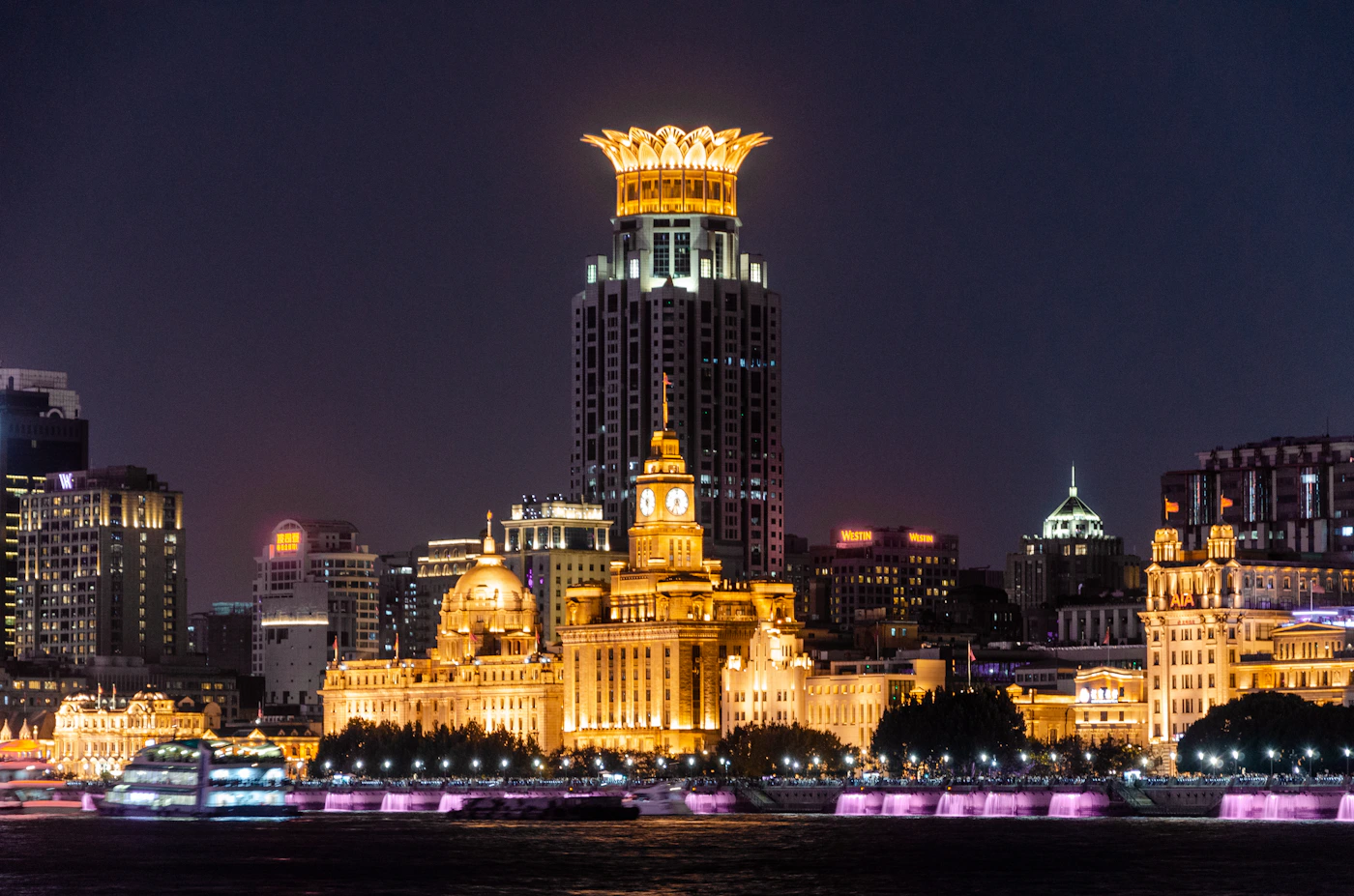 The Bund and Shanghai skyline glowing at night, China