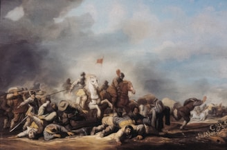 A historical battle scene with numerous soldiers engaged in combat. Some soldiers are on horseback, with one prominently placed white horse in the center. Soldiers on foot are wielding spears and swords. The sky is cloudy with smoke, suggesting the chaos and intensity of the battle. There are injured or fallen soldiers on the ground, highlighting the brutality of the conflict.