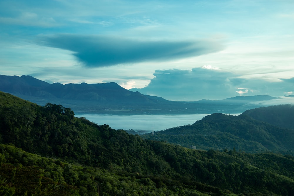 a view of a mountain range with a body of water in the distance