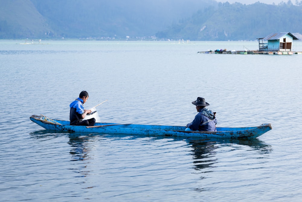 a couple of people that are on a boat in the water