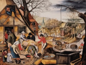 A bustling village scene featuring people engaged in various activities such as preparing food, carrying barrels, and working outside their homes. The village has rustic houses with thatched roofs, and vibrant trees line the path running through the settlement. In the foreground, several figures are preparing a large pig for cooking, while children and other adults observe and assist.