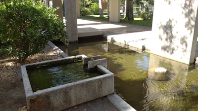 A tranquil water feature installation with flowing water surrounded by natural stones.