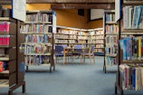 a library filled with lots of books and chairs
