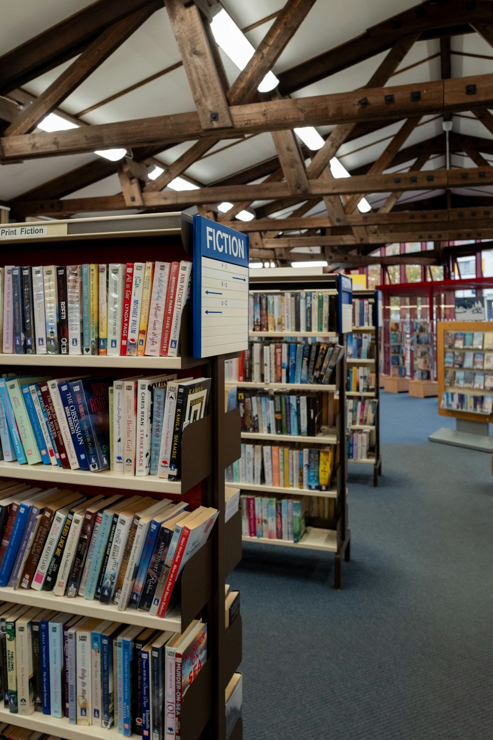 a row of shelves filled with lots of books