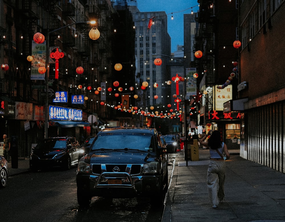 a city street with cars parked on the side of it