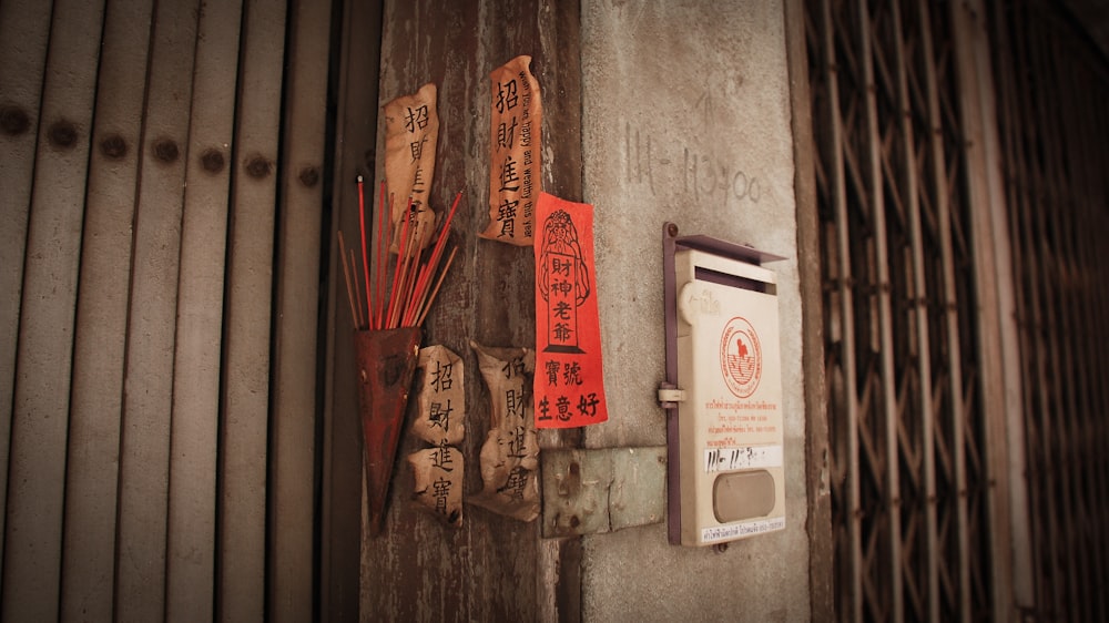 a bunch of signs hanging on the side of a building