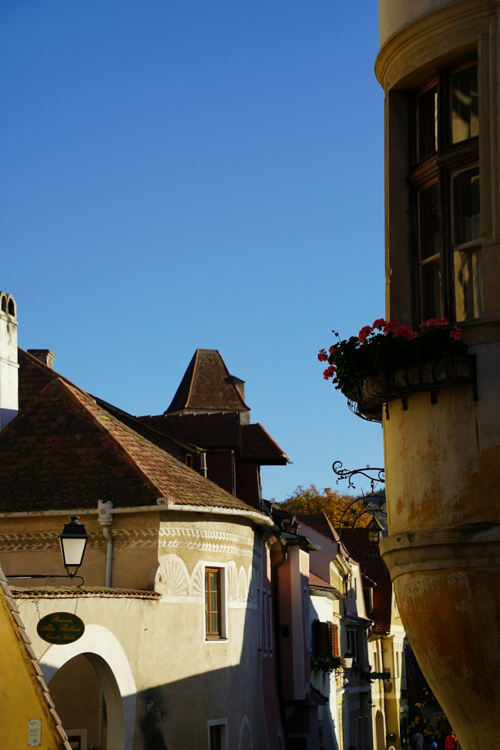 a view of a building with a clock tower in the background