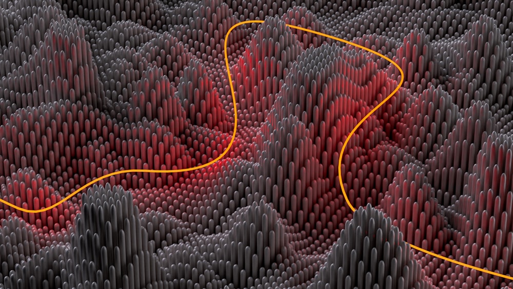 a red and black pattern with a yellow line going through it