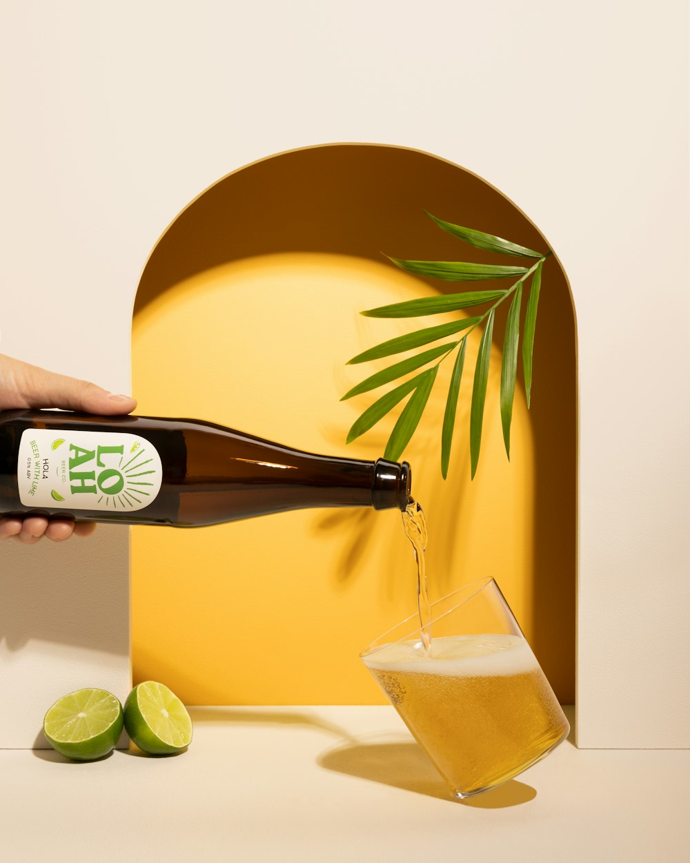 a bottle of beer being poured into a glass