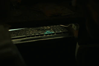 A tense scene of a hacker’s hands typing rapidly on a holographic keyboard.