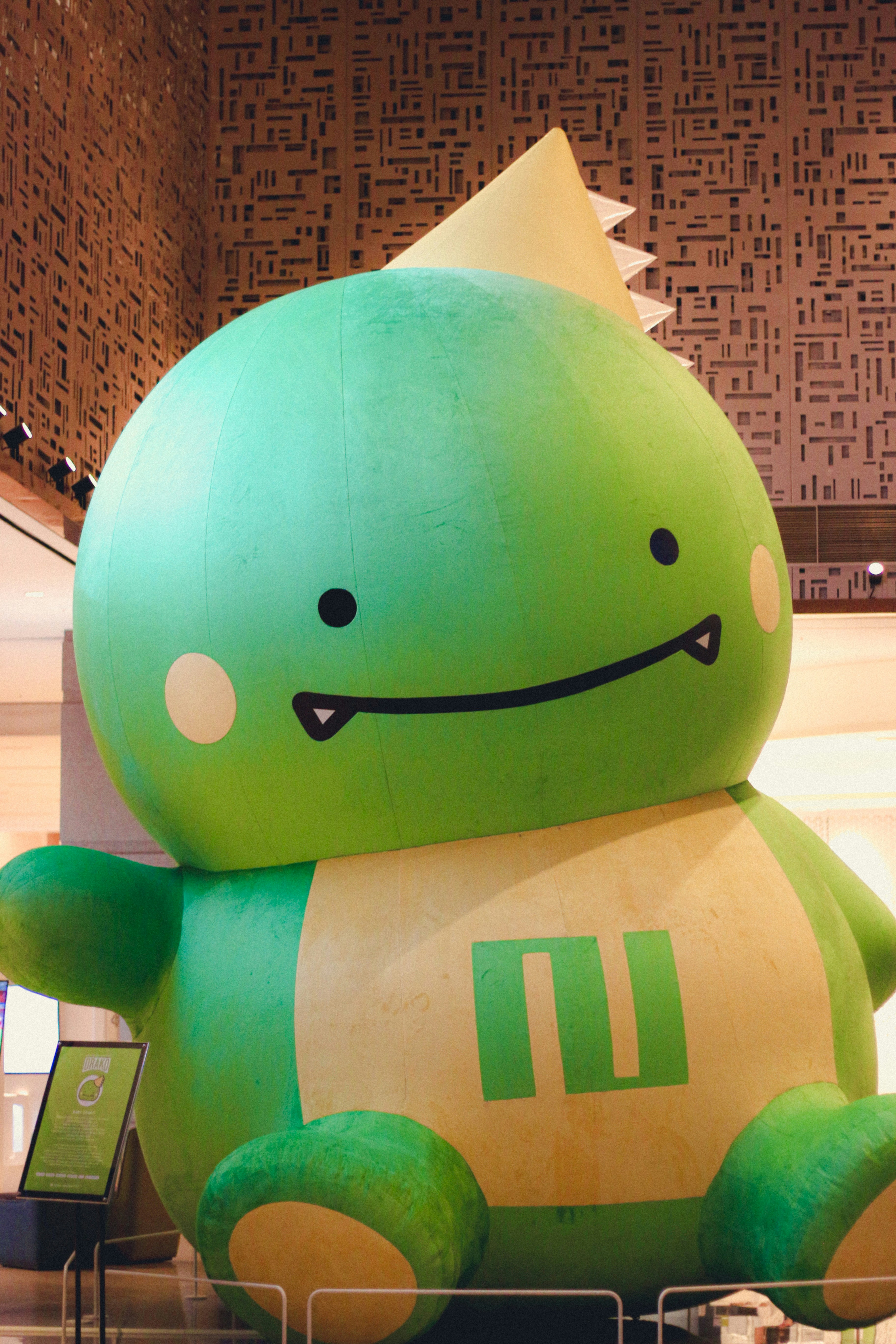 Soft dinosaur plush toy in green with friendly face, perfect for toddlers 2-4 years