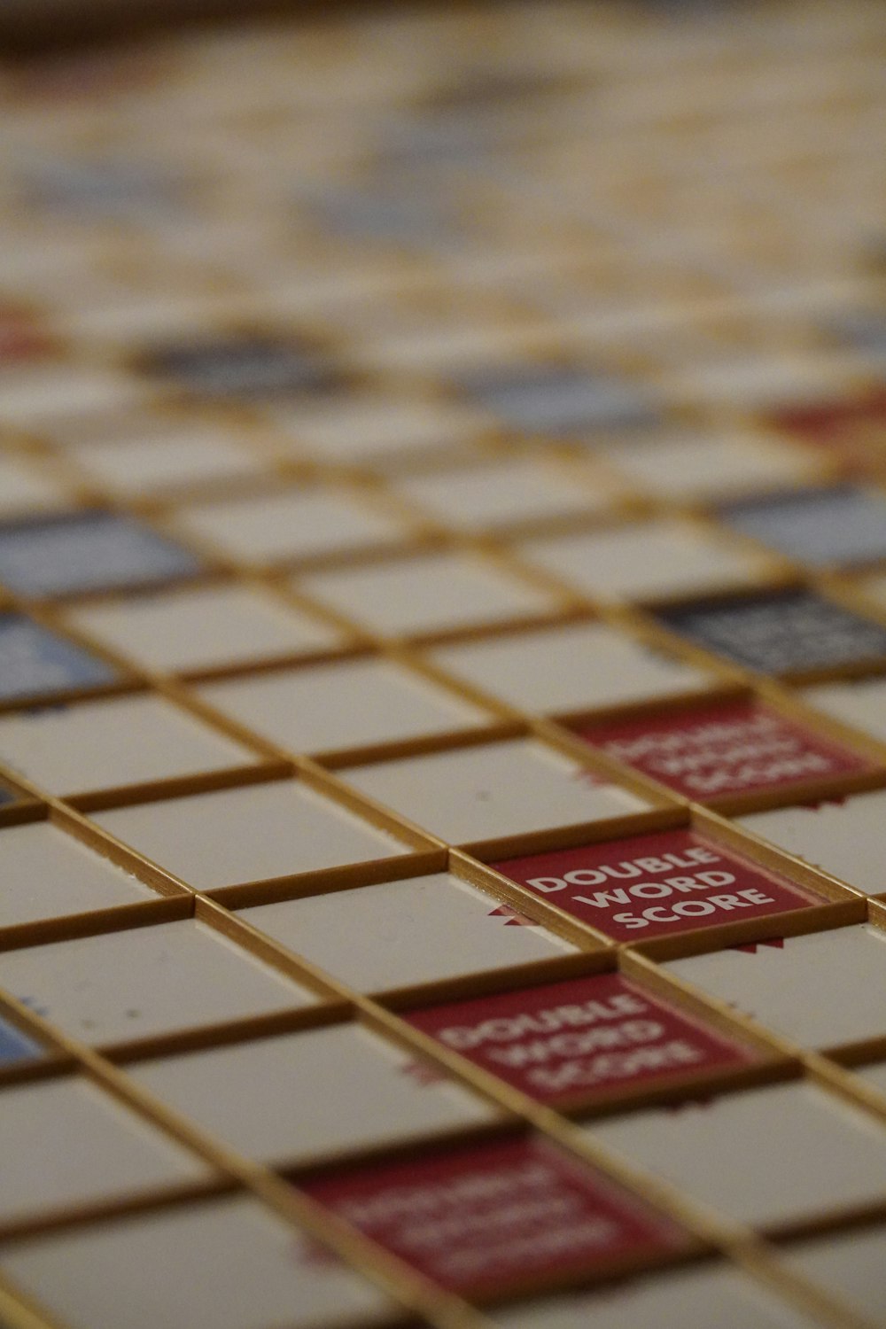 a close up of a tile pattern with red and white squares