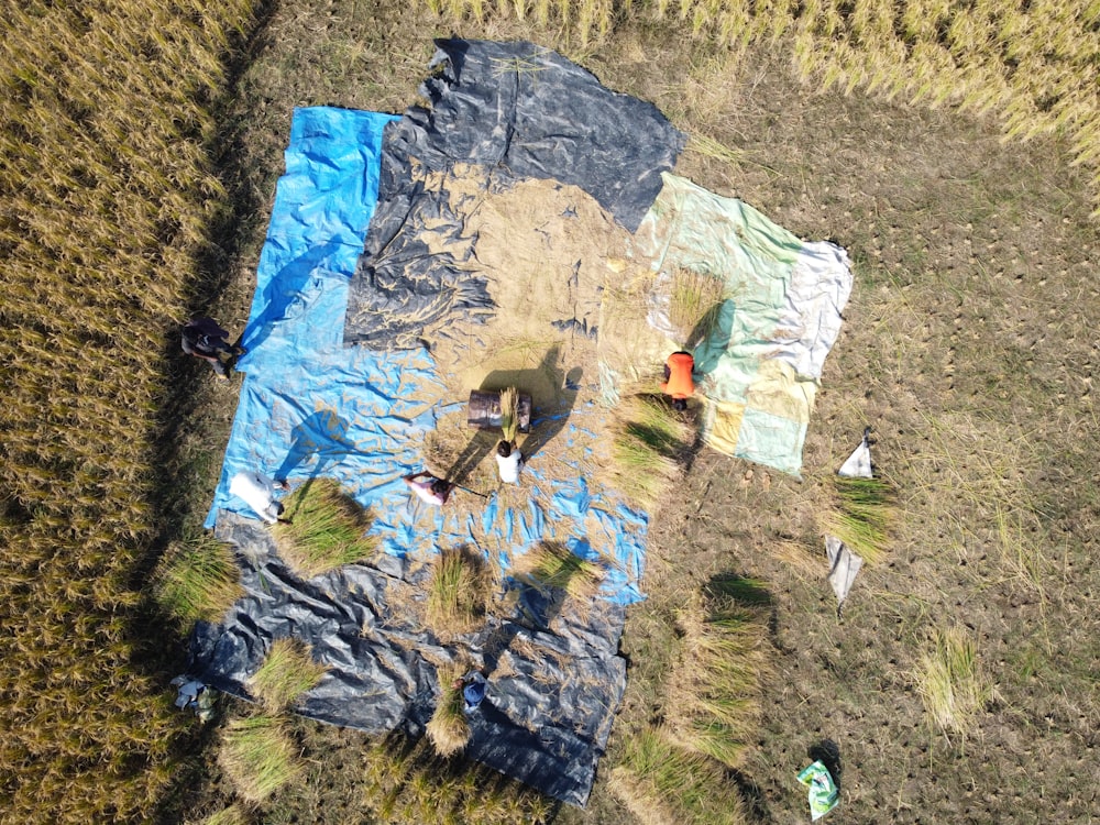 an aerial view of a field with a tarp on it