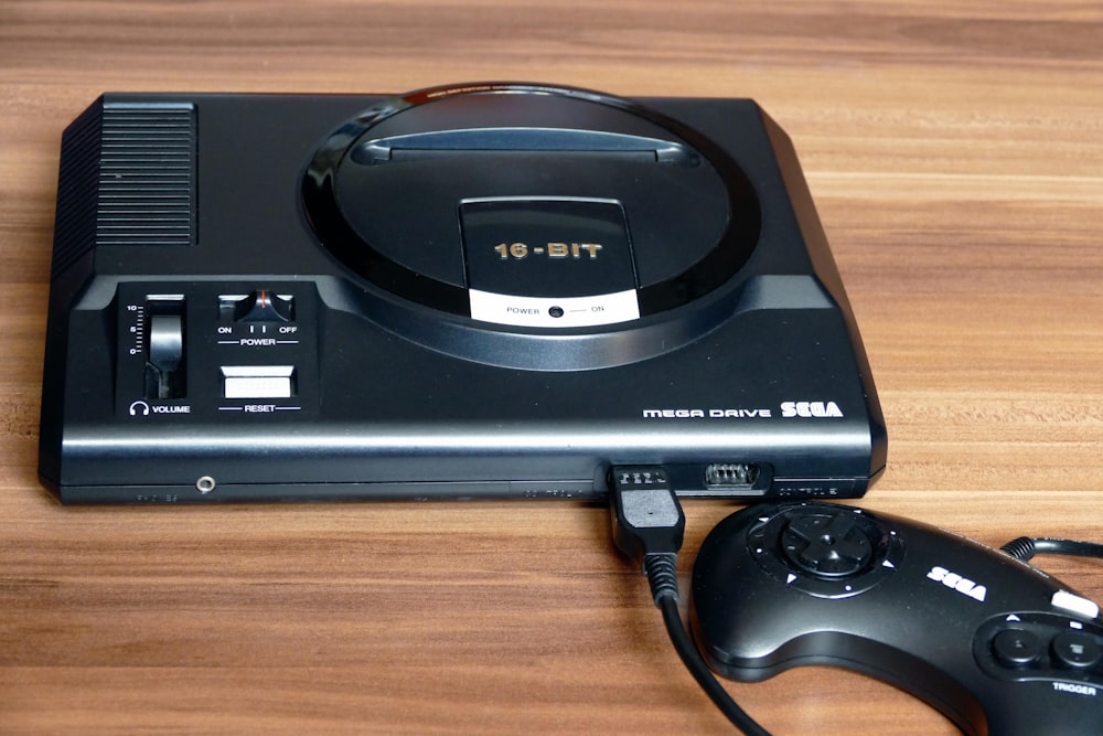 a video game system sitting on top of a wooden table