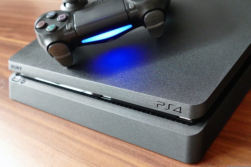 a video game console sitting on top of a wooden table