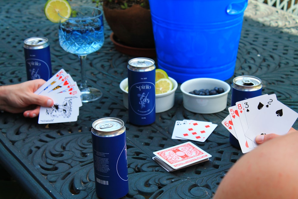 a table topped with lots of cards and drinks