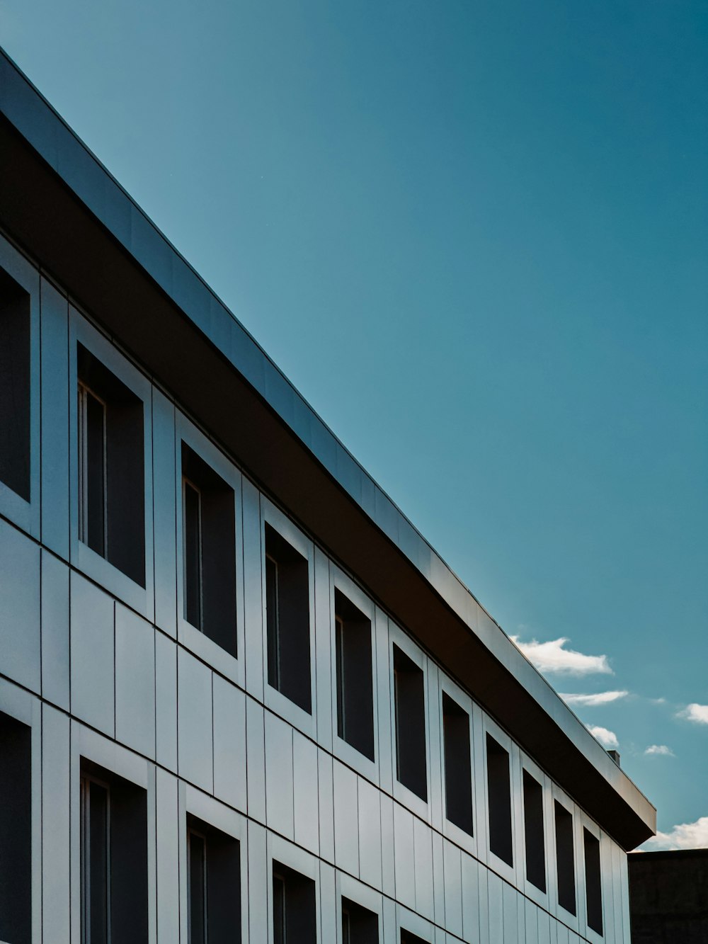 a tall building with lots of windows on the side of it