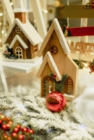 A festive scene featuring handcrafted wooden Christmas decorations with subtle painted accents.