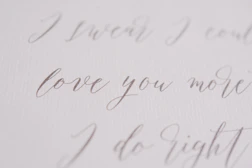 Soft watercolor textures blending with scripture verses written in elegant serif typography.