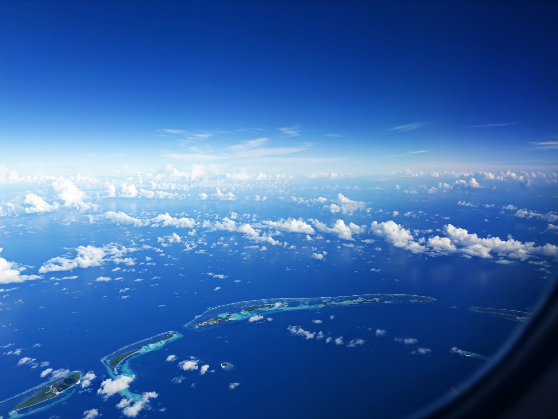 a view of the ocean from an airplane window