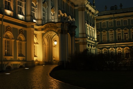 An elegant outdoor space featuring architectural lighting that highlights the building's structure.