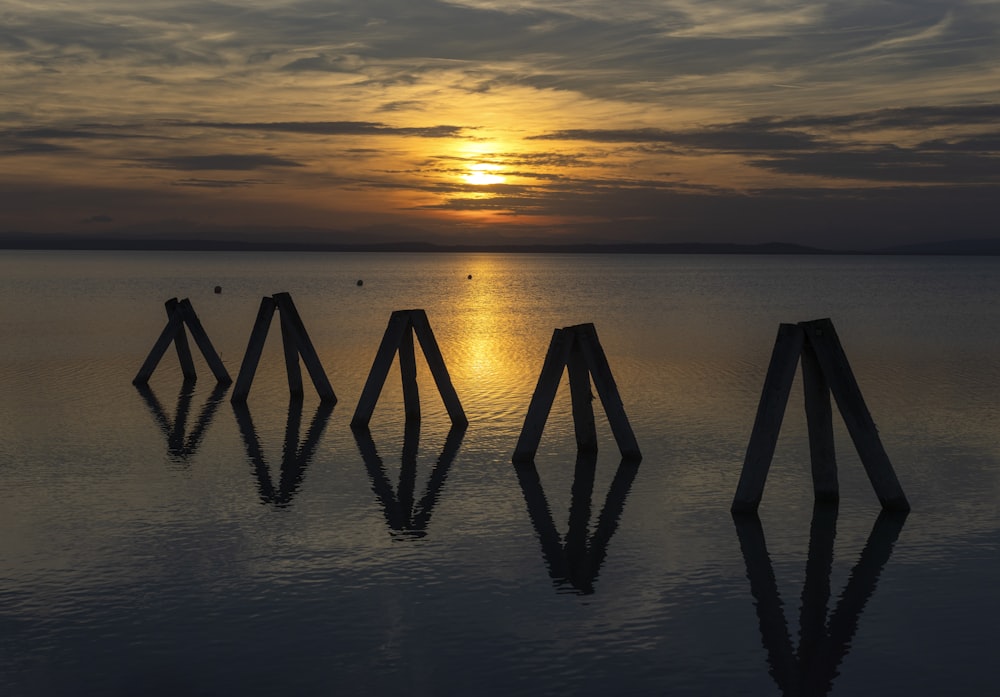 the sun is setting over a body of water