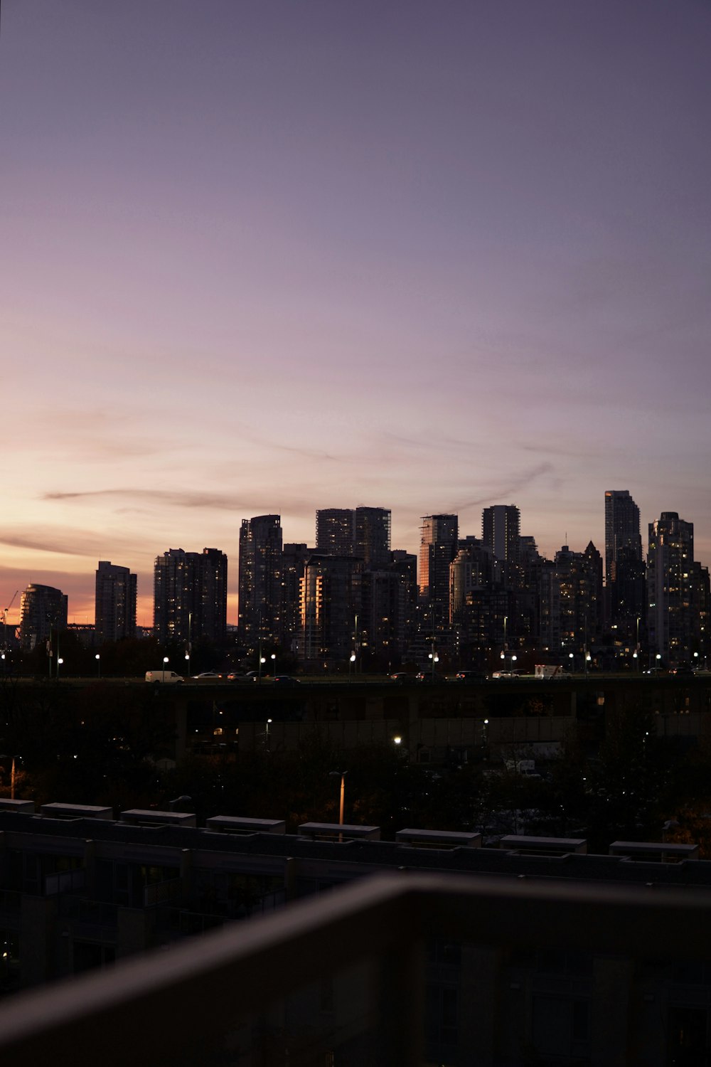 a view of a city at night from a balcony