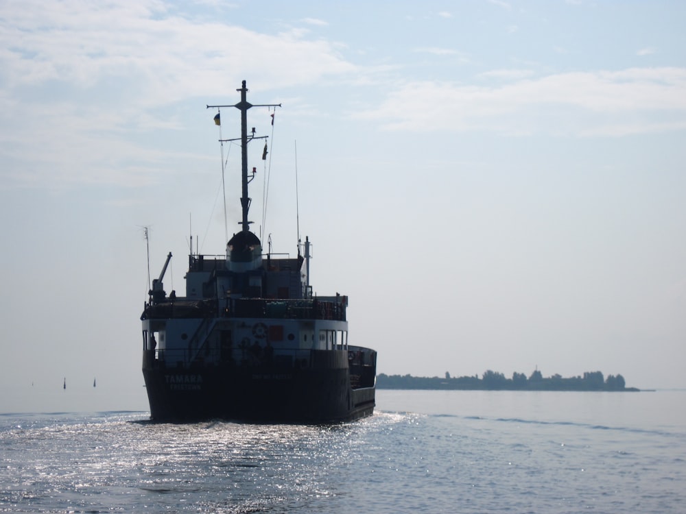 a large boat traveling across a large body of water