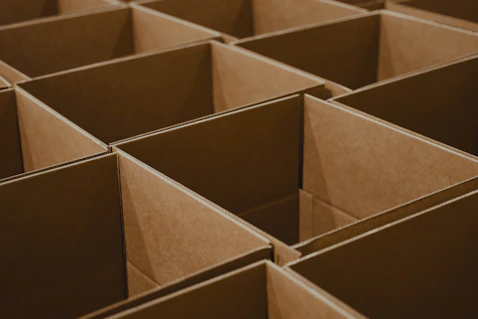 A close up view of empty cardboard boxes assembled and ready for inventory sorting and package prep