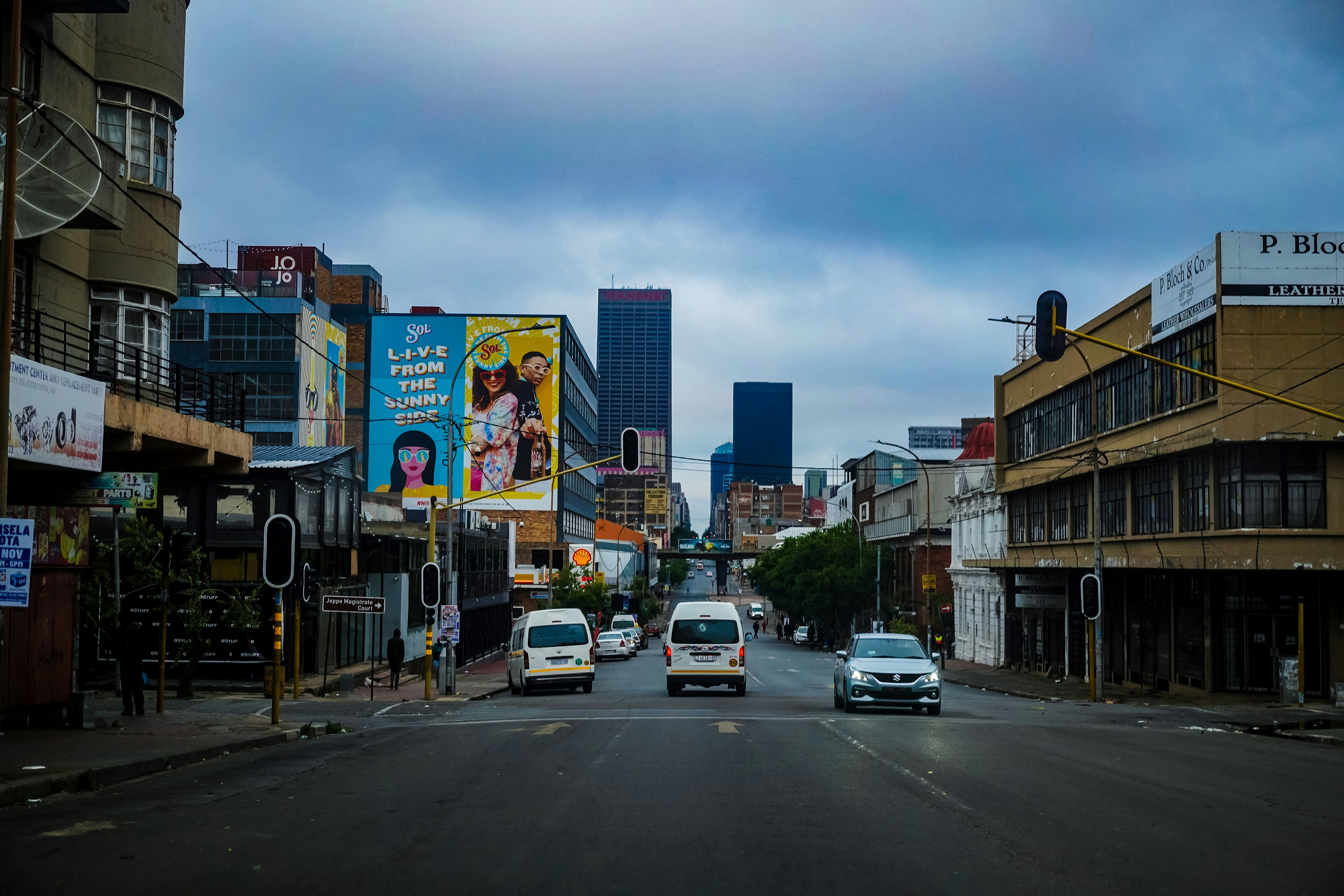 a city street filled with lots of tall buildings