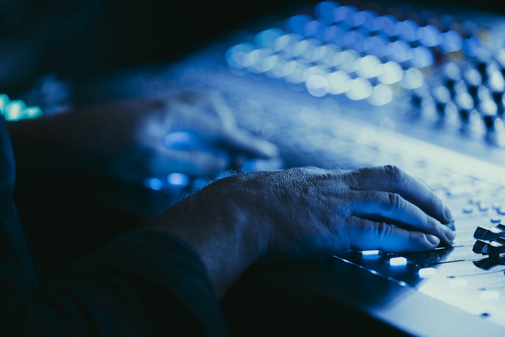 a close up of a person typing on a keyboard