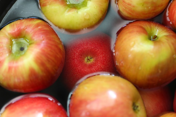 A bunch of apples that are in a bowl