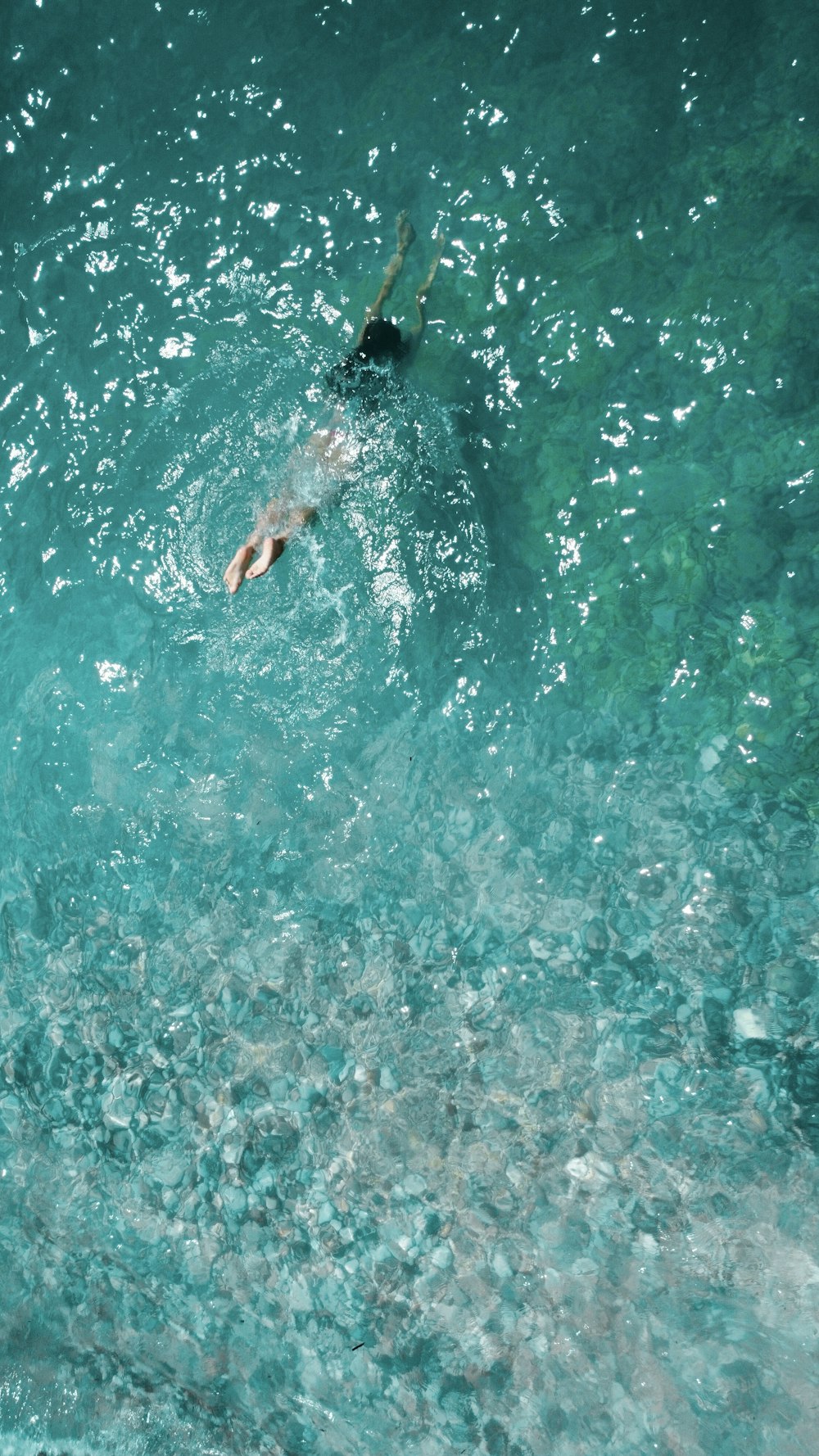 a person swimming in a body of water