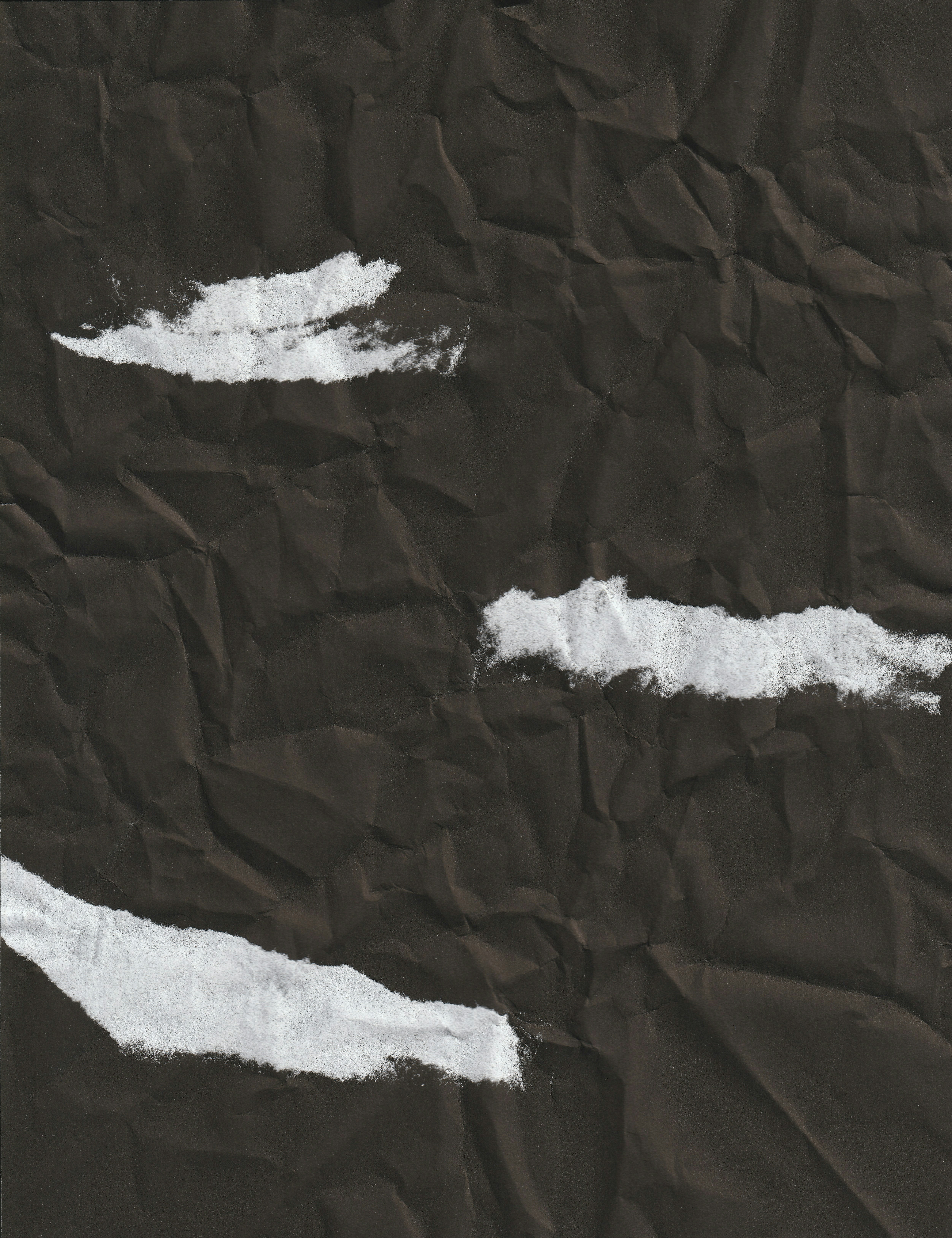 a piece of paper with white paint on it