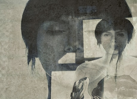 An artistic composition featuring a double exposure effect with faded, overlapping images of a person's face and silhouette. The image has an aged, textured look, giving it a vintage, mysterious feel.