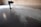 Close-up of a smooth, glossy epoxy floor in a modern industrial space.