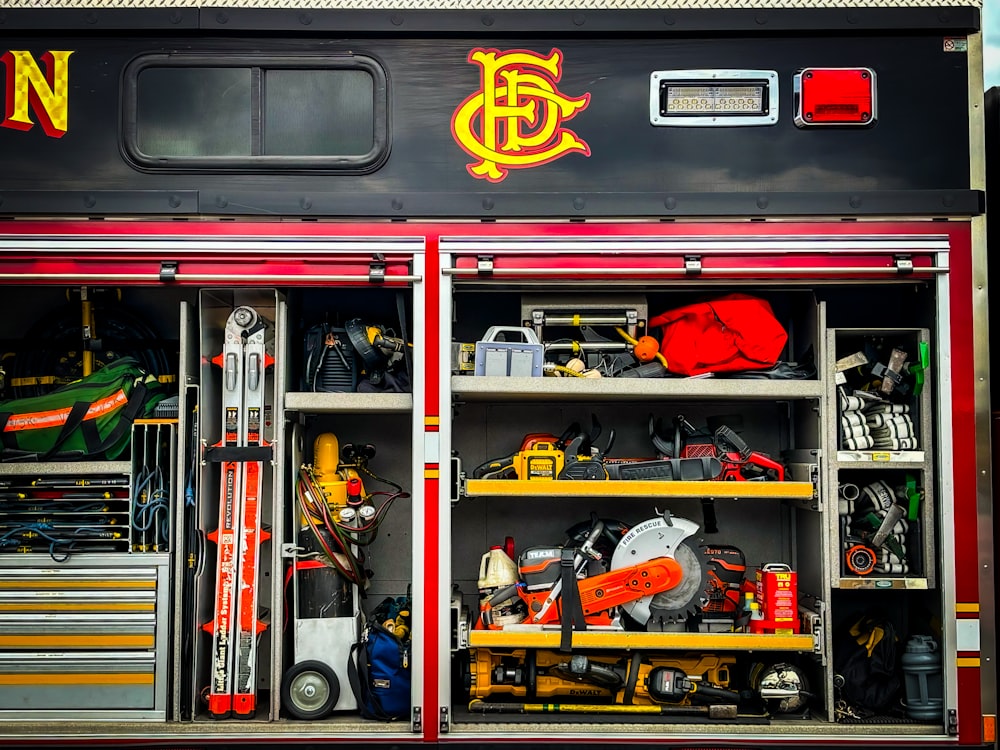 a fire truck with a bunch of tools inside of it