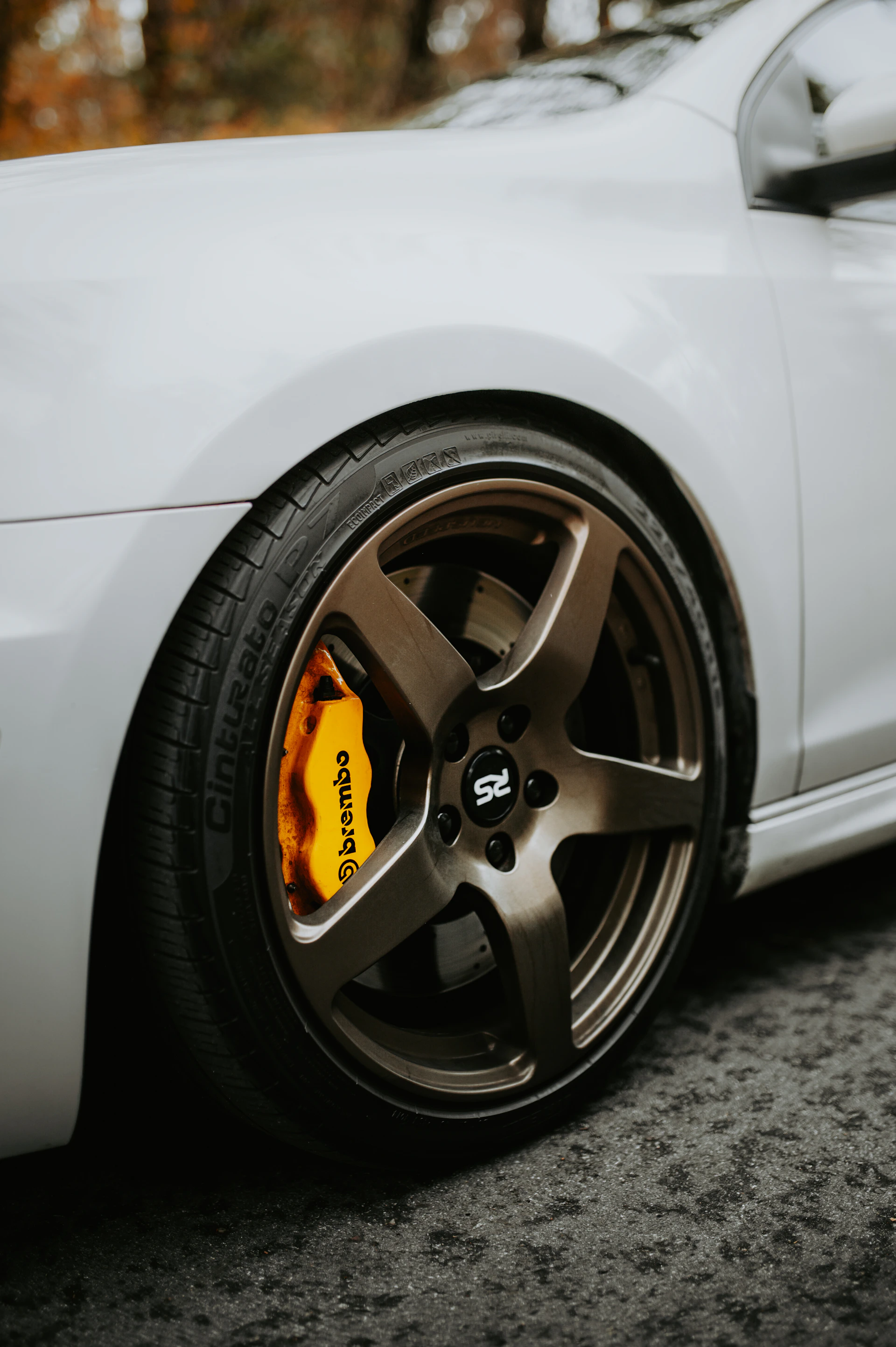 a close up of a car tire on a street