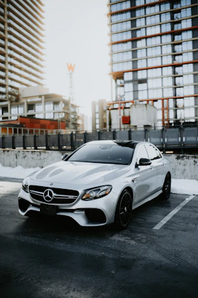 Sleek black Mercedes-Benz S-Class parked in an elegant urban setting at dusk
