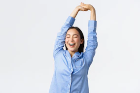 a woman with her arms in the air