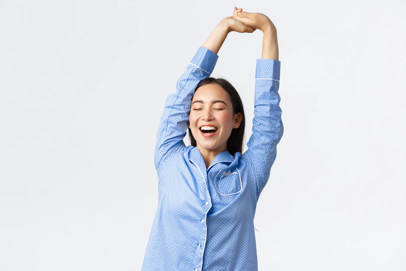 a woman with her arms in the air
