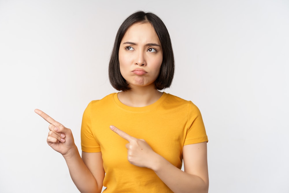 a woman making a funny face with her finger